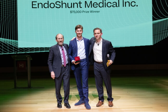 Harvard SEAS graduate student Michael Finn-Henry standing between interim president Alan Garber and Harvard Innovation Labs director Matt Segneri